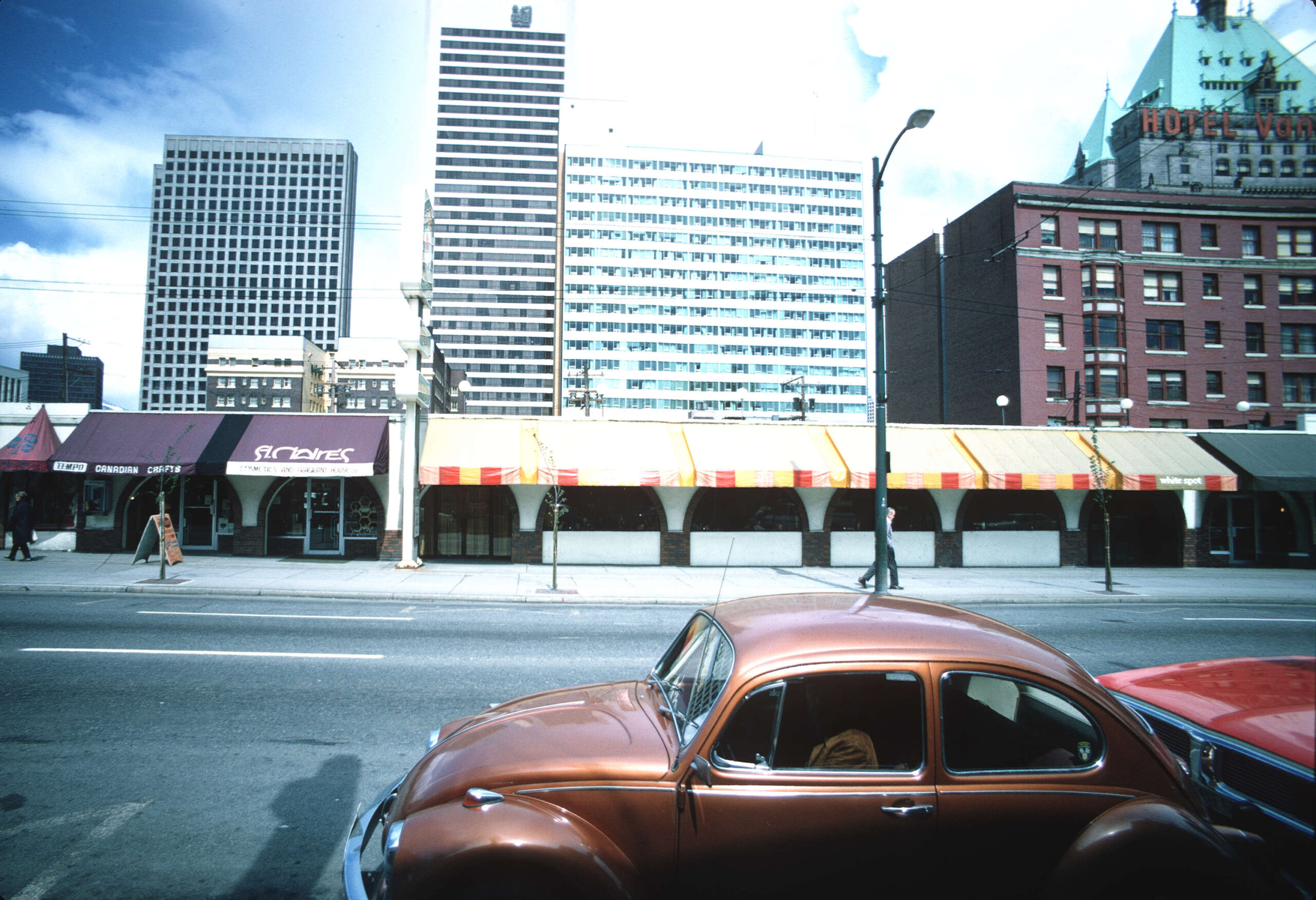 The Hotel Vancouver peeks out and looks over 1000 Robson Street north side, 1974. Reference code: COV-S509-: CVA 778-320