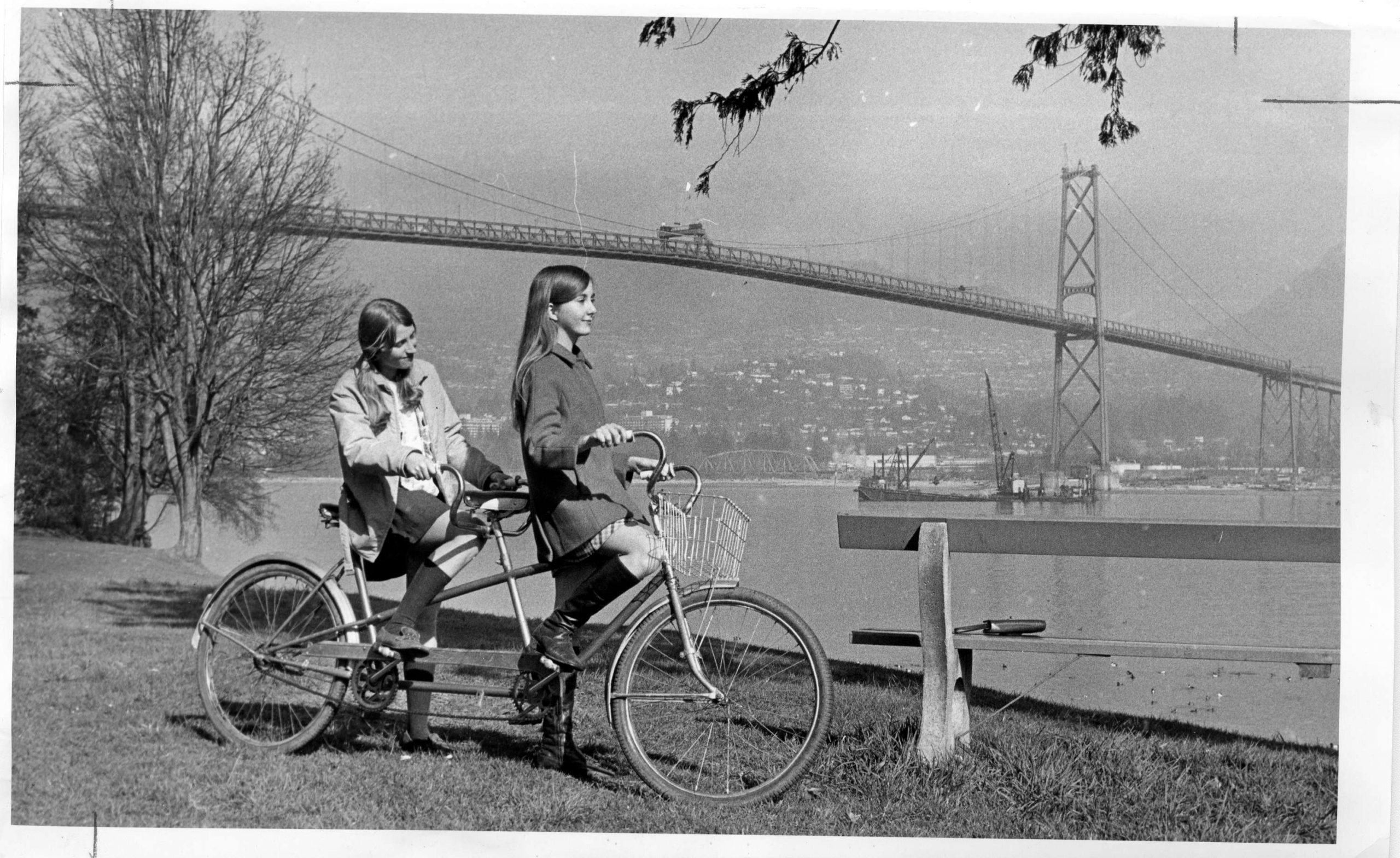 Pausing on a tandem bicycle in Stanley Park. Reference code: AM1667-: CVA 134-047