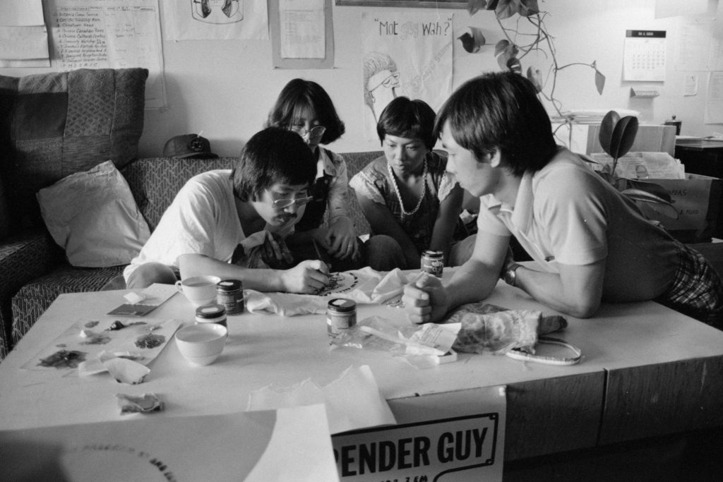 Jim Wong-Chu leading a silk-screening session for Pender Guy, 1977. Reference code: AM1523-S6-F13-: 2008-010.1052 