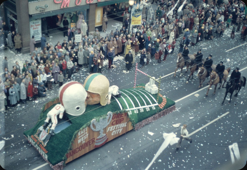 43rd Grey Cup Parade, on Granville Street, Welcome to Friendly Vancouver Grey Cup float, police on horseback and spectators; Reference code: AM1517-S1-: 2008-022.290.