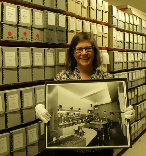 Christine Hagemoen with one of the prints that inspired her to write this post about Vancouver’s diners. Photograph by Cindy McLellan.