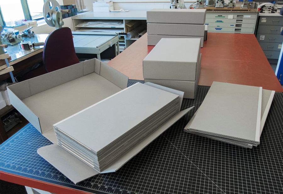 Several boxes of empty mats ready to be filled. Photograph by Kathy Kinakin.