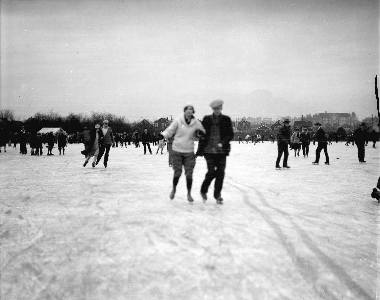 Skaters with houses in the background