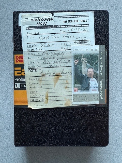 Videocassette case with Sid Chow Tan’s business card enclosed. Photo by Abigail Sebaly. Reference code: AM1698-S2-: 2023-092.0056