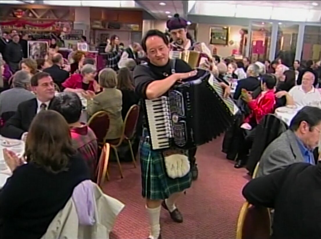 Still of the Gung Haggis Fat Choy Robbie Burns Dinner, with founder Todd Wong in the foreground, ca. 1999. Reference code: AM1698-S4-: 2023-092.0093