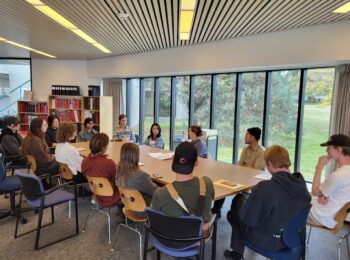 A class group gathered for an orientation in the Reading Room.