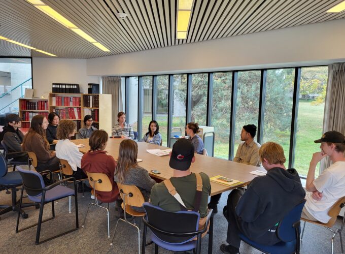 A class group gathered for an orientation in the Reading Room.