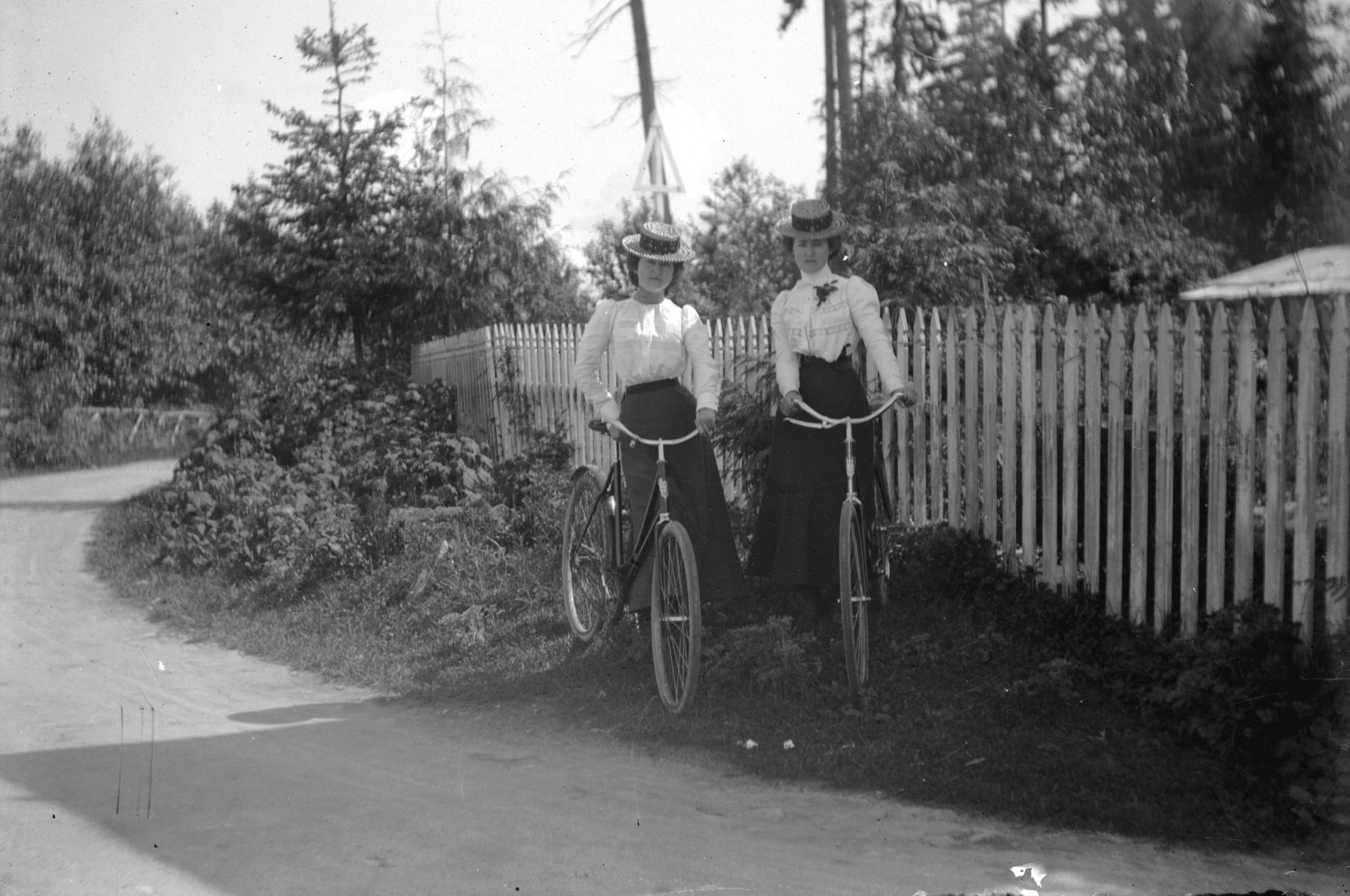 Two women standing with bicycles in Stanley Park. Reference code: AM54-S4-: SGN 119