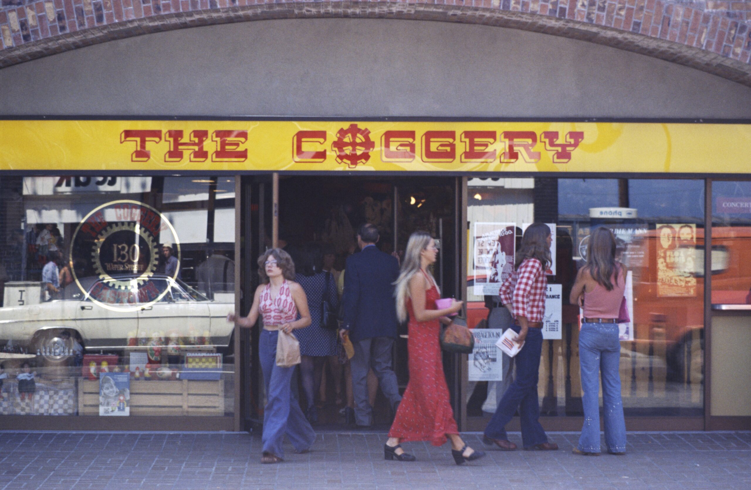 Shoppers outside The Coggery at 130 Water St. Reference code: COV-S644: CVA 1095-08037