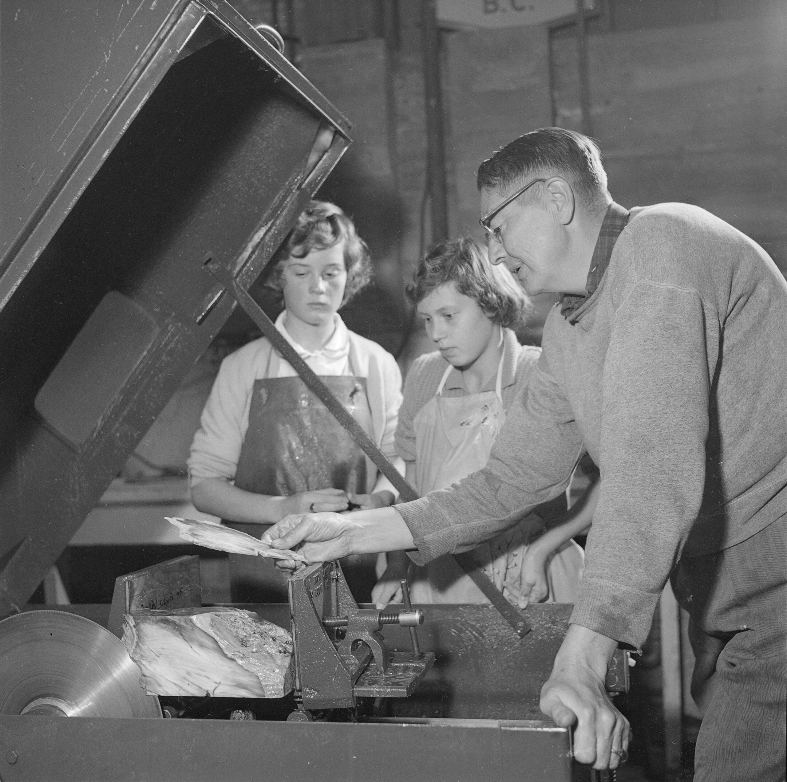 Two girls learning how to use lapidary machinery at Marpole Community Centre, 1961. Reference code: COV-S625-: CVA 392-1560