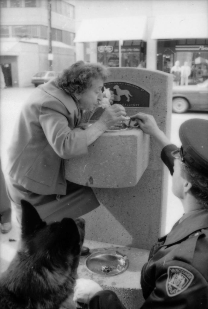 Theresa Galloway drinking from fountain at unveiling ceremony, 1986. Reference code: COV-S477-3-F111-: CVA 775-189-: CVA 775-189.24