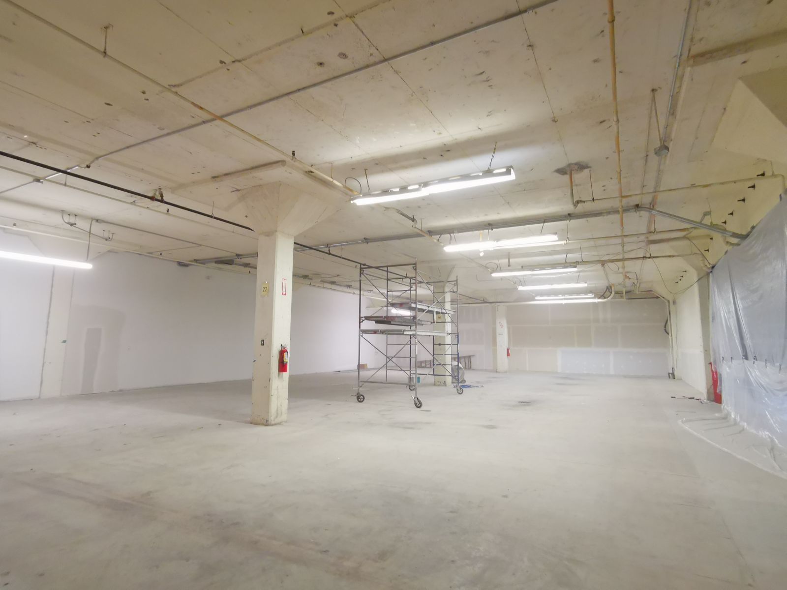 Space with orange insulation scraped off the ceiling