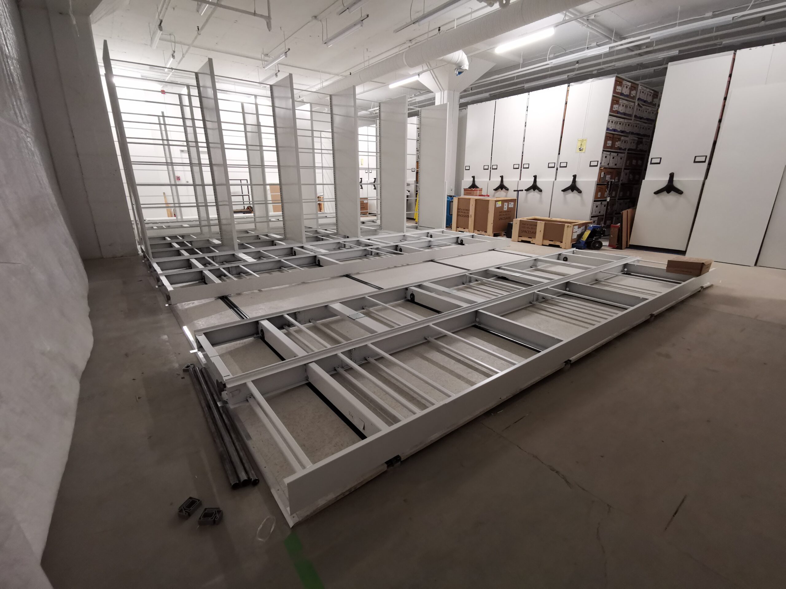 Last section of mobile shelving being installed