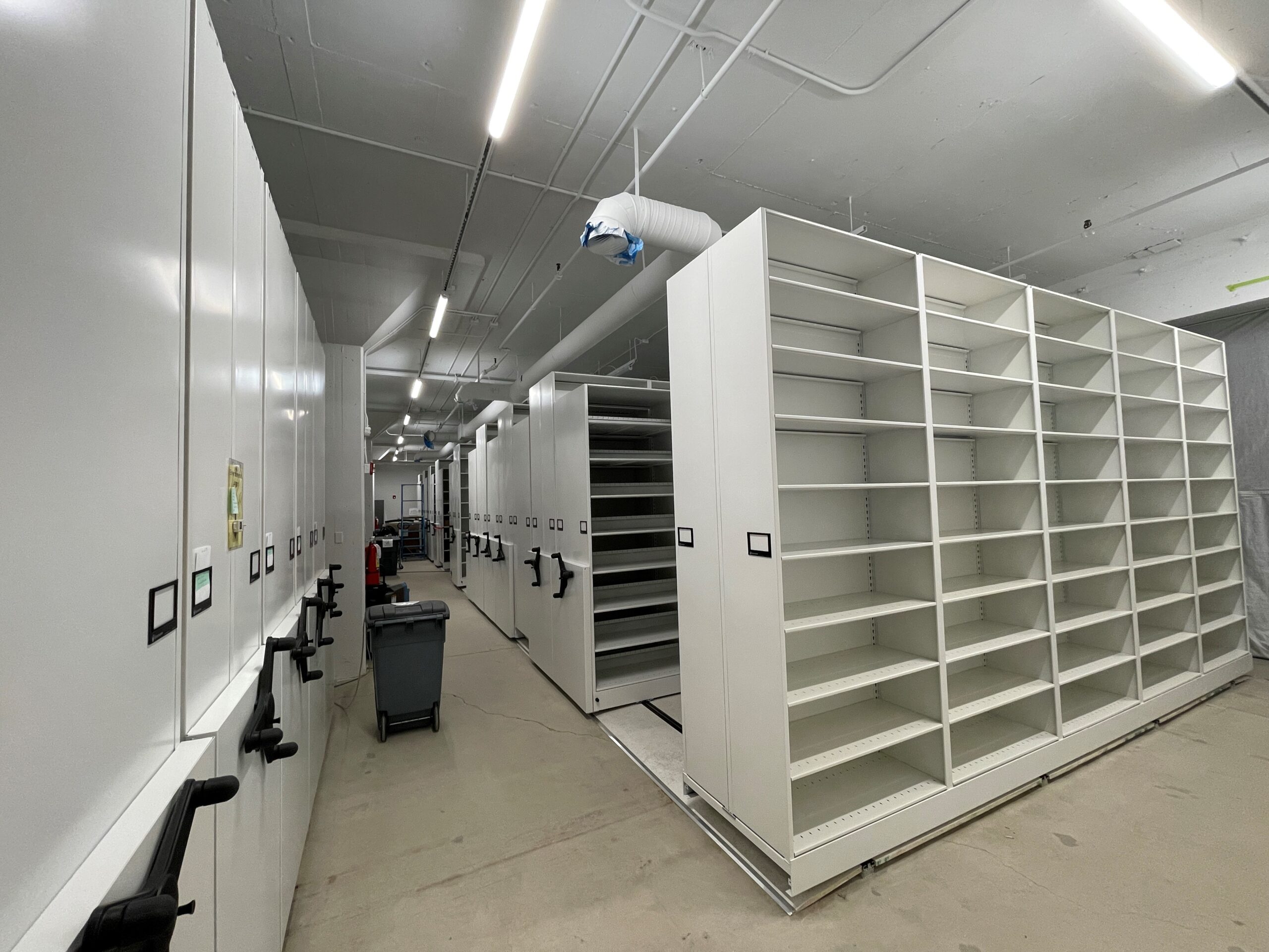 Last section of mobile shelving being installed