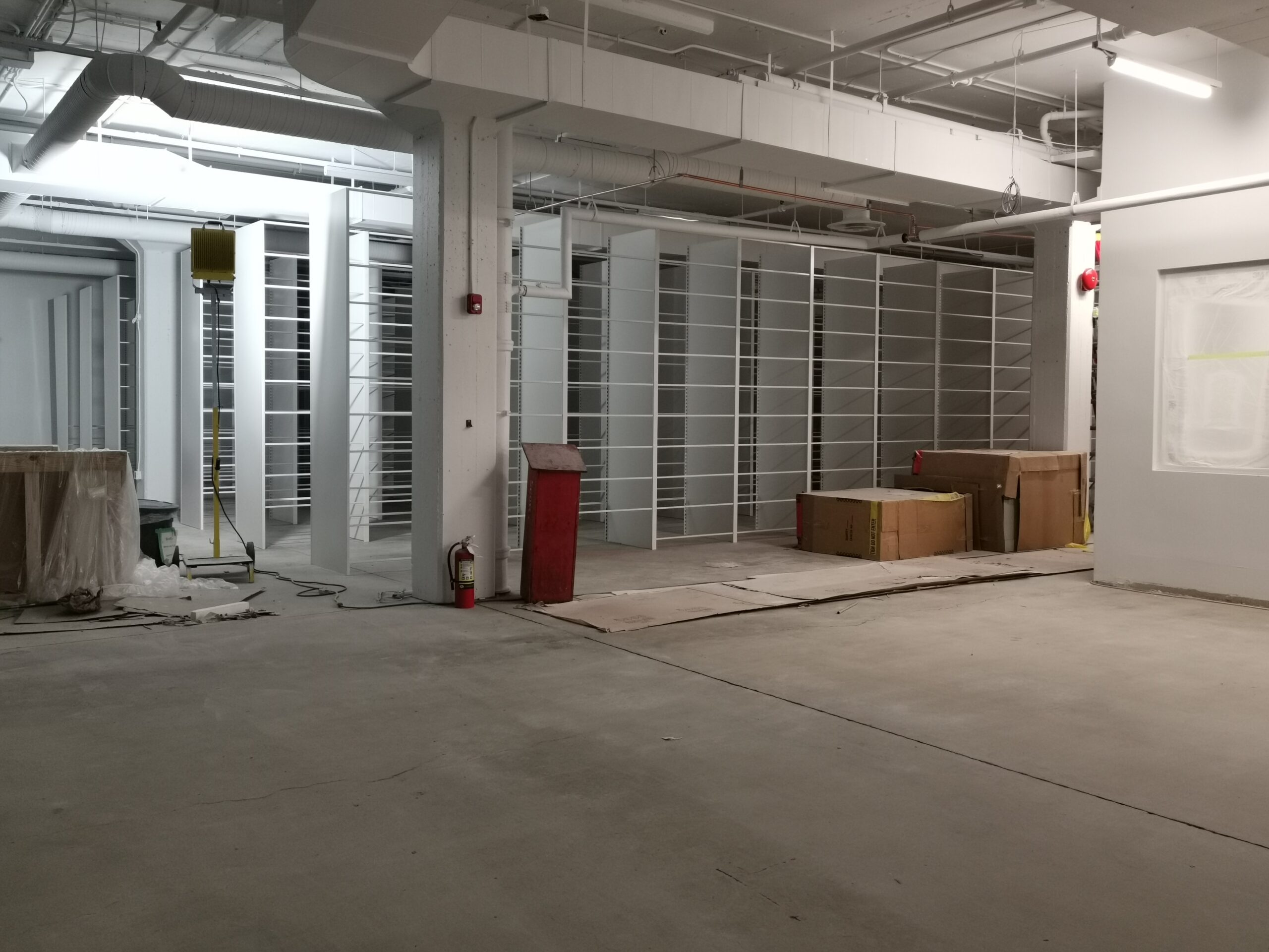 Static shelving units being installed