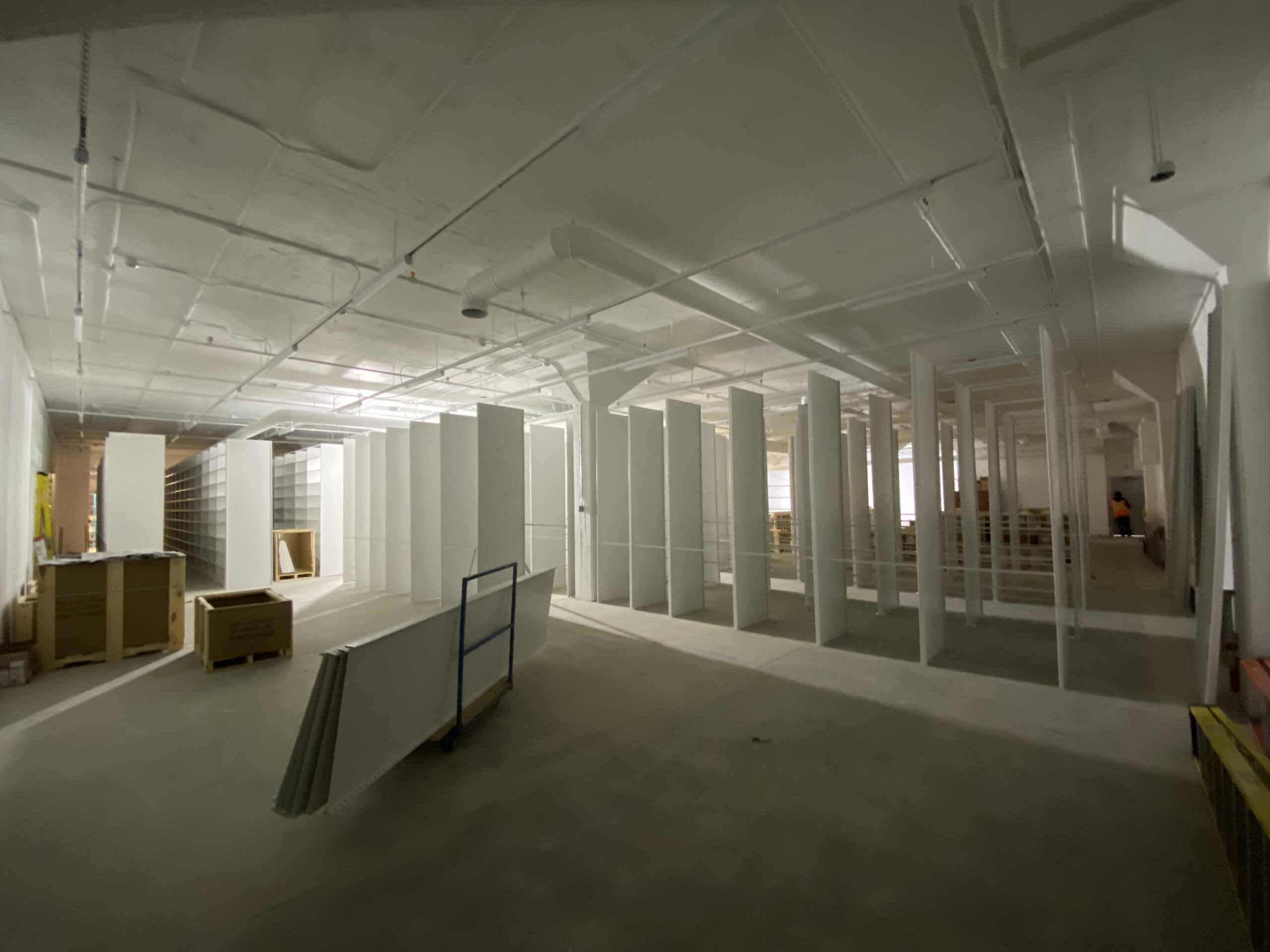 Static shelving units being installed