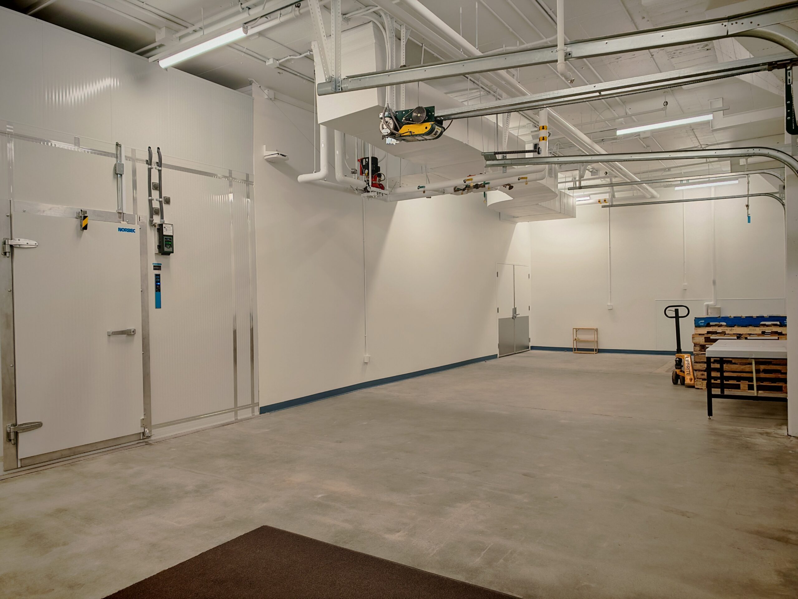 Loading bay with frozen storage vault on the left