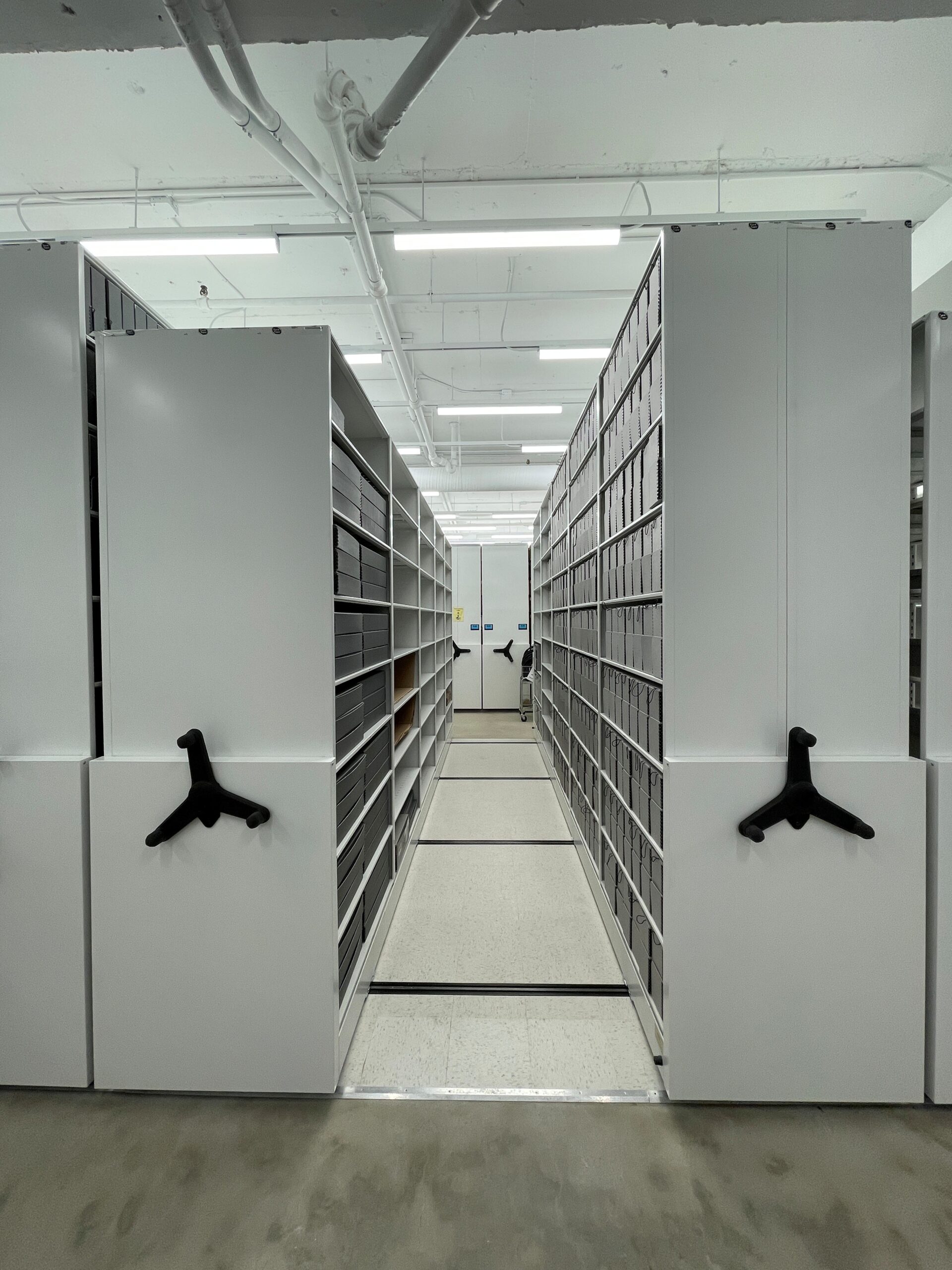 Third section of mobile shelving looking through to first section