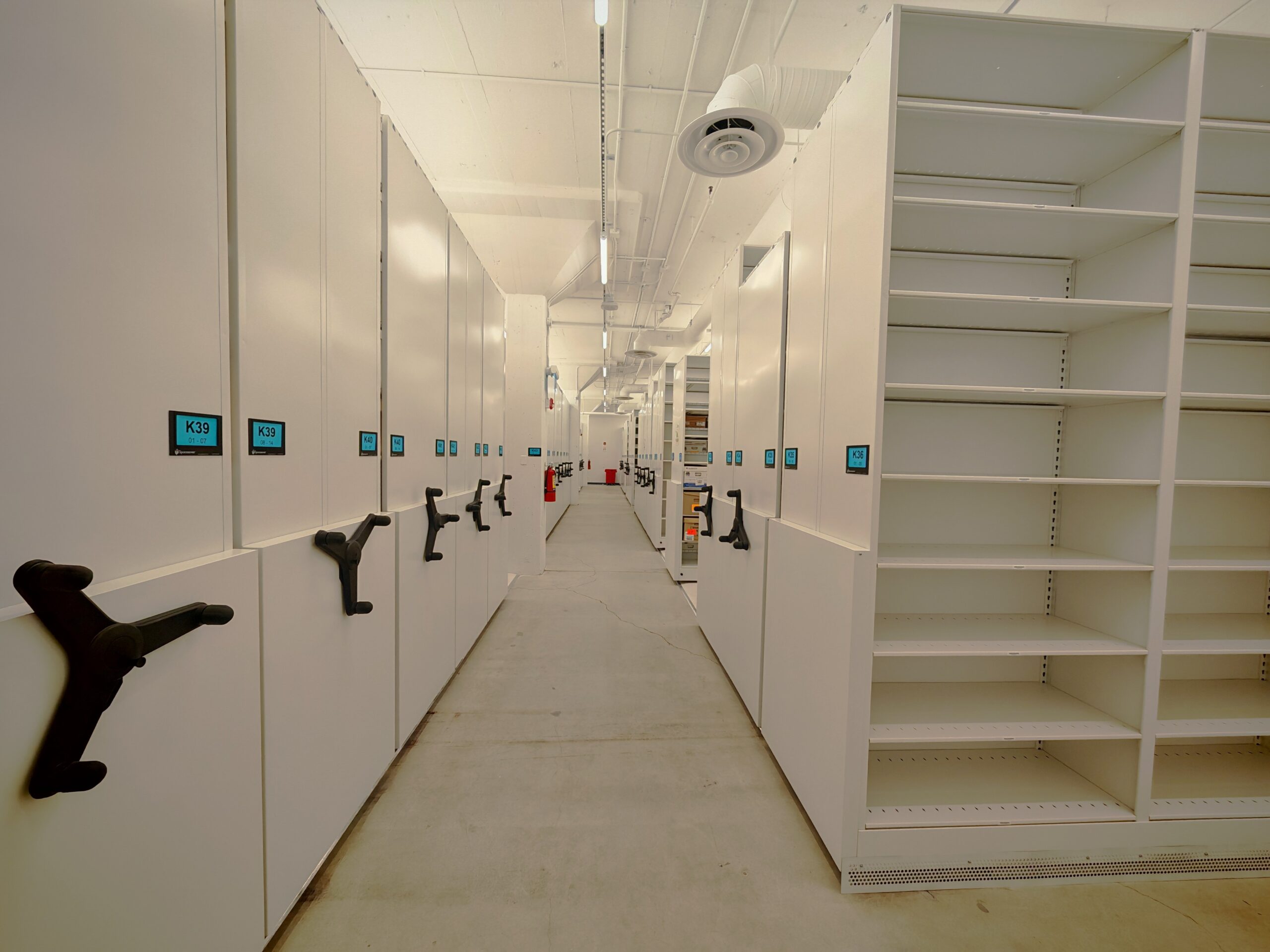 Aisle between 1st and 2nd/3rd sections of mobile shelving