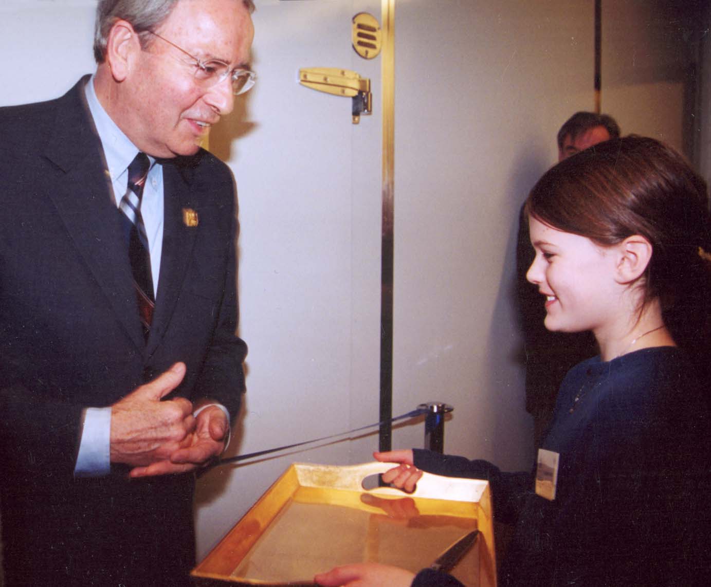 Mayor Owen being offered scissors